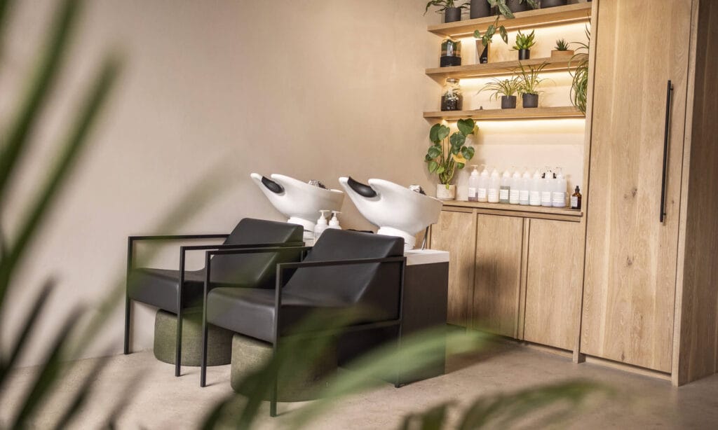 Wash basins and oak storage units inside mosu hair space